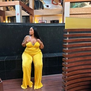 Gold satin jumpsuit, super sexy in the back. The back is out. For the tall girls